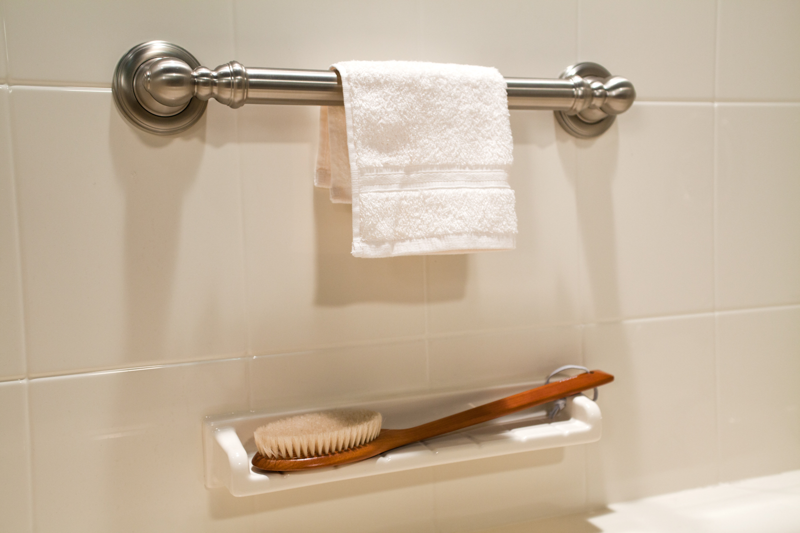 Almond flush-mount shelf with brushed nickel towel bar on 8x10 walls