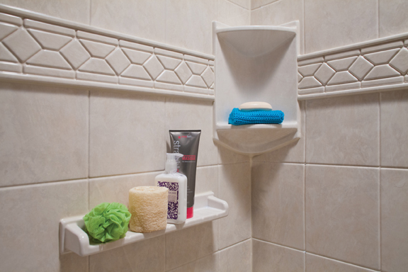 Corner shelf with listello trim and tile walls