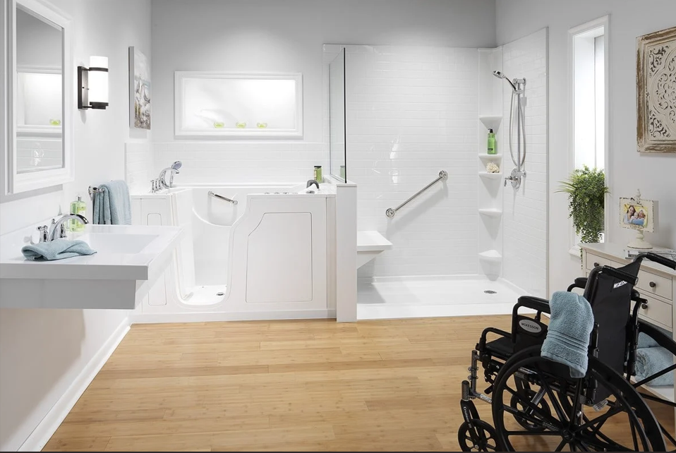 Accessible bathroom featuring ultra low shower base with wheelchair access, walk-in tub, grab bars, and handheld shower